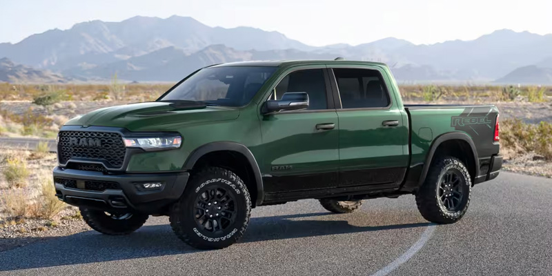 Green RAM Rebel truck on desert road