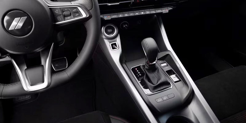 The steering wheel and gear shifter of a Dodge Hornet