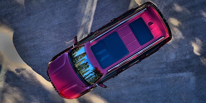 Jeep Grand Wagoneer SUV top view with panoramic sunroof.