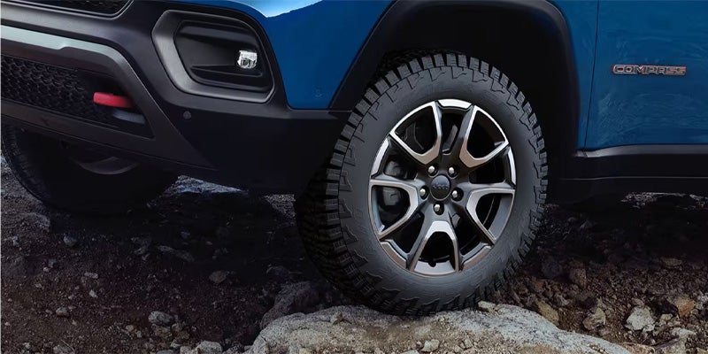 Off-road Jeep Compass tire on rocky terrain