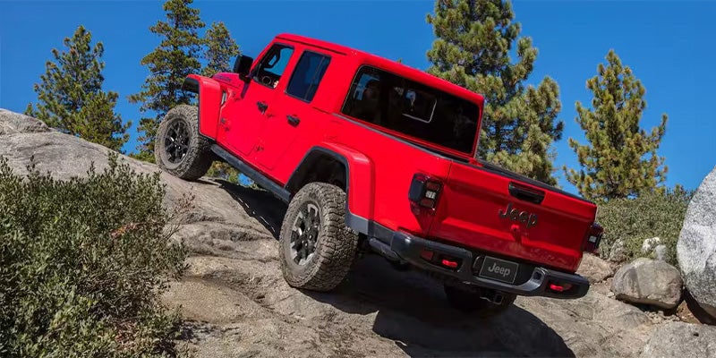 Jeep Gladiator climbing steep rocky trail