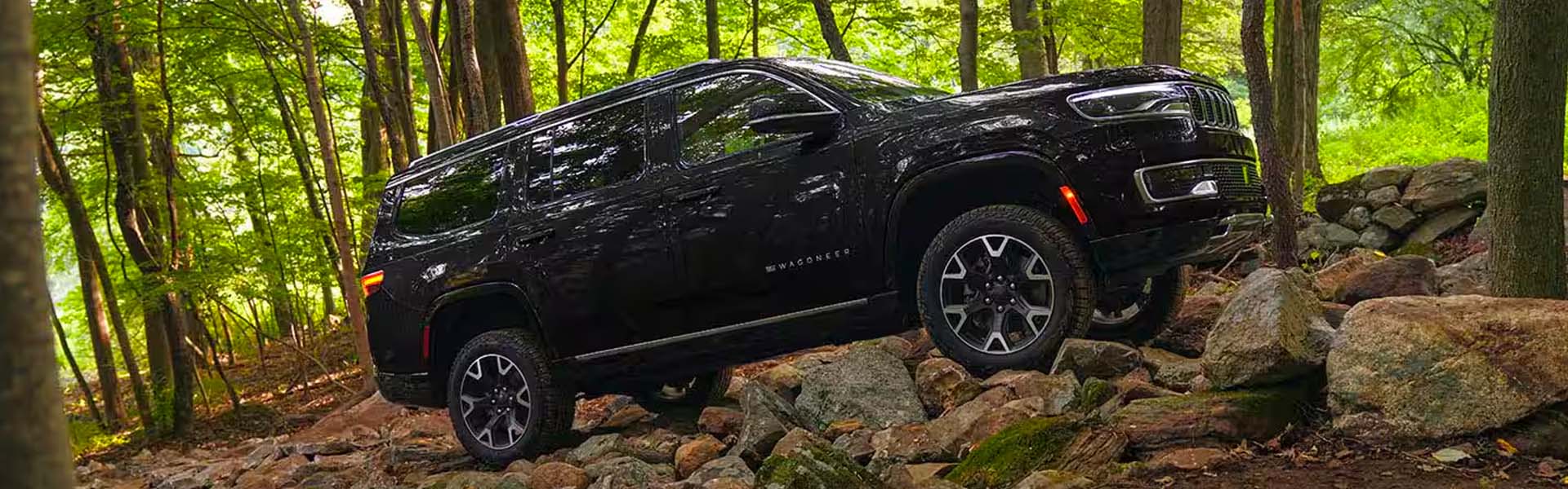 Jeep Wagoneer on a rocky trail