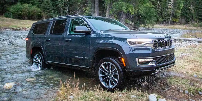 Jeep Wagoneer fording a stream