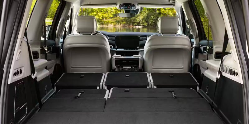 The interior of a Jeep Wagoneer with seats down
