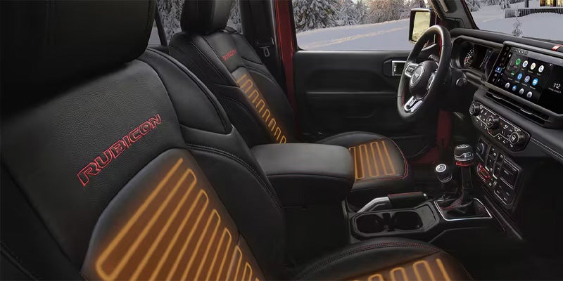 Jeep Wrangler interior with black and orange seat accents