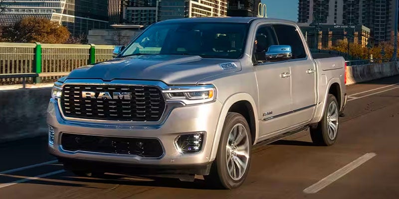 Ram 1500 truck driving in a city